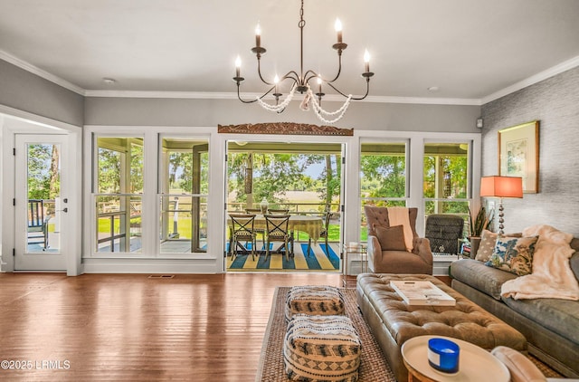 70 Dolphin Point Dr, Beaufort, SC 29907 - living area featuring a chandelier, plenty of natural light, wood finished floors, and ornamental molding
