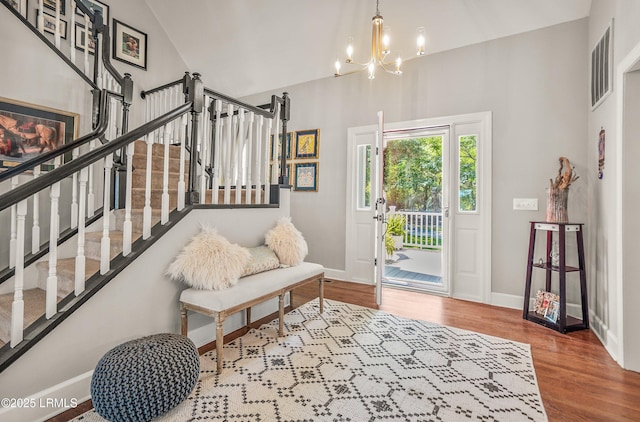 70 Dolphin Point Dr, Beaufort, SC 29907 - entrance foyer featuring a chandelier, stairs, and wood finished floors
