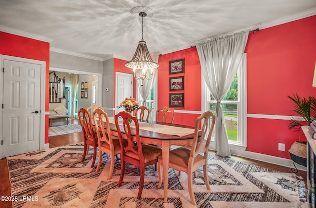 70 Dolphin Point Dr, Beaufort, SC 29907 - dining area featuring a chandelier, wood finished floors, and crown molding