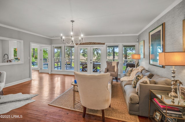 70 Dolphin Point Dr, Beaufort, SC 29907 - living room featuring french doors, a chandelier, healthy amount of natural light, wood finished floors, and crown molding