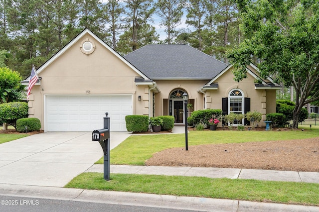 170 Pinecrest Cir, Bluffton, SC 29910 - traditional-style home featuring stucco siding, an attached garage, driveway, a front yard, and roof with shingles