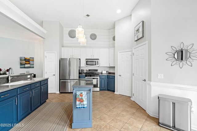 170 Pinecrest Cir, Bluffton, SC 29910 - kitchen with stainless steel appliances, blue cabinets, a sink, light tile patterned flooring, and white cabinets