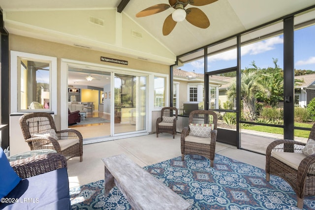 sunroom with visible vents, vaulted ceiling with beams, and ceiling fan