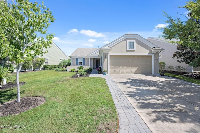 single story home featuring a garage and a front yard