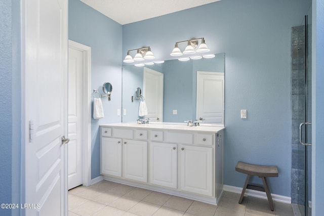 bathroom with vanity, tile patterned flooring, and a shower with shower door