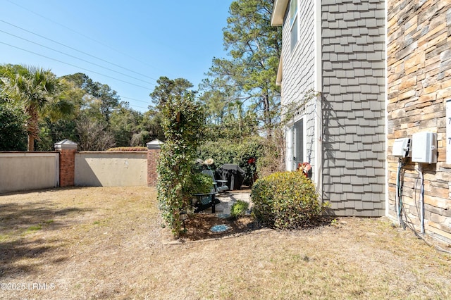 view of yard featuring fence