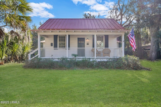 1104 Greene St, Beaufort, SC 29902 - bungalow with a porch, a front lawn, a standing seam roof, and metal roof