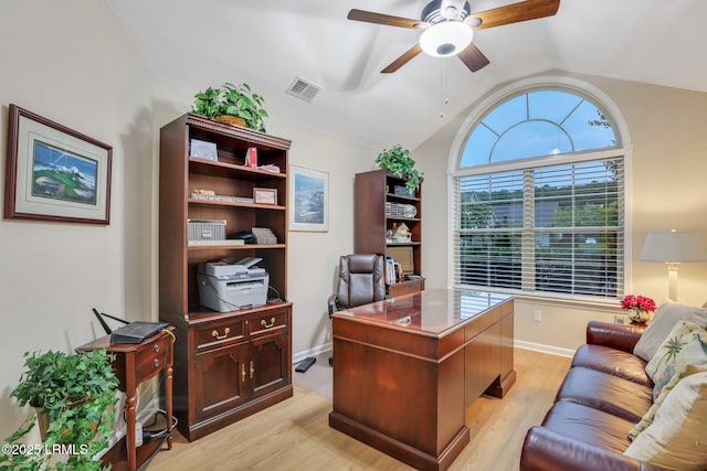 home office featuring vaulted ceiling, light hardwood / wood-style floors, and ceiling fan