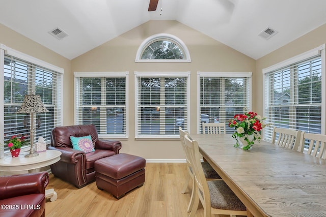 interior space with ceiling fan, plenty of natural light, and vaulted ceiling