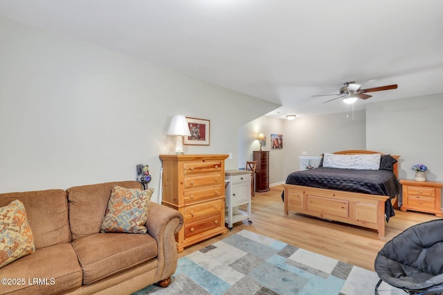 bedroom with ceiling fan and light hardwood / wood-style floors