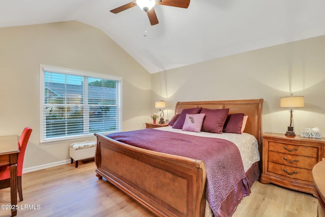 bedroom with vaulted ceiling, ceiling fan, and light hardwood / wood-style floors