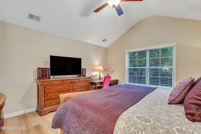 bedroom featuring lofted ceiling, light hardwood / wood-style floors, and ceiling fan