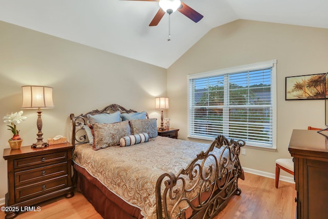 bedroom featuring lofted ceiling, light hardwood / wood-style flooring, and ceiling fan