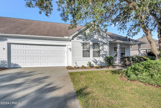 single story home with a garage and a front yard