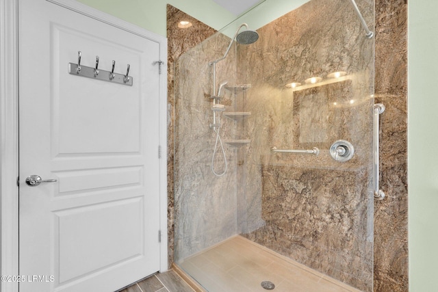 full bathroom featuring a marble finish shower