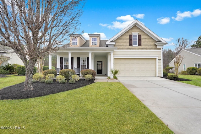 view of front of property featuring driveway, an attached garage, a porch, and a front lawn