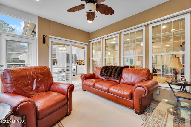 living area with a ceiling fan