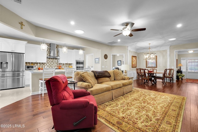 living room featuring recessed lighting, visible vents, ceiling fan, and hardwood / wood-style flooring