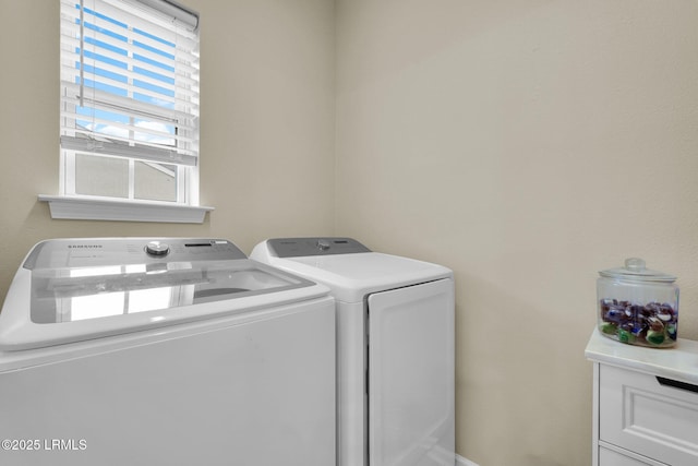 clothes washing area with laundry area and washing machine and clothes dryer