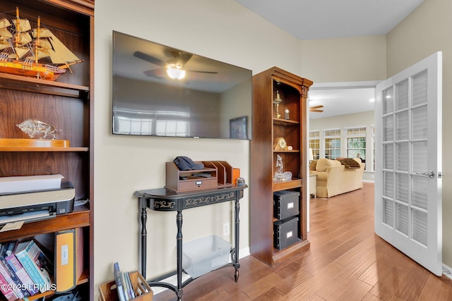 interior space featuring ceiling fan and wood finished floors