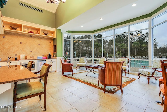 sunroom / solarium featuring visible vents