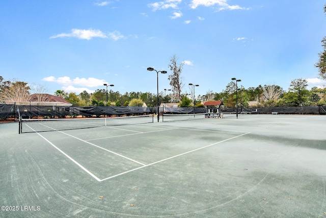 view of sport court with fence