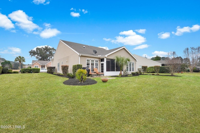 rear view of property with stucco siding and a yard