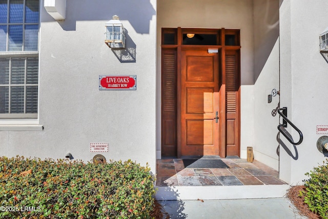 10 Abbey Row Unit 1A, Beaufort, SC 29906 - doorway to property featuring stucco siding