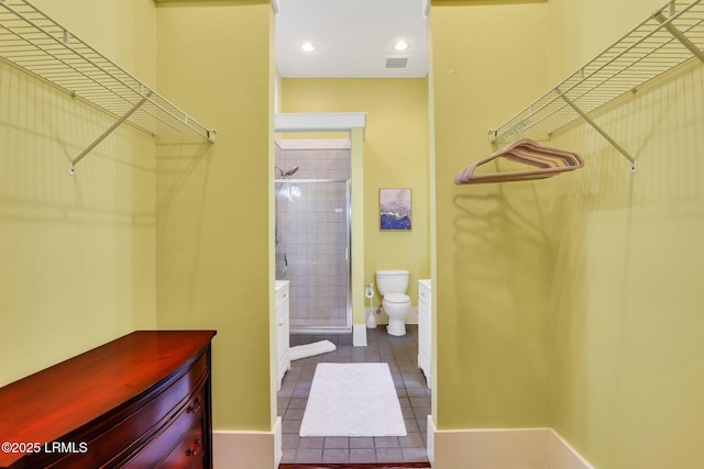 10 Abbey Row Unit 1A, Beaufort, SC 29906 - spacious closet featuring visible vents and dark tile patterned floors