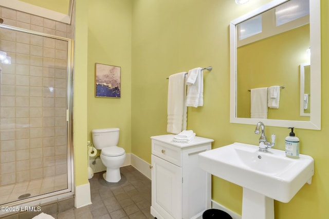 10 Abbey Row Unit 1A, Beaufort, SC 29906 - full bath with toilet, a sink, a shower stall, tile patterned flooring, and baseboards