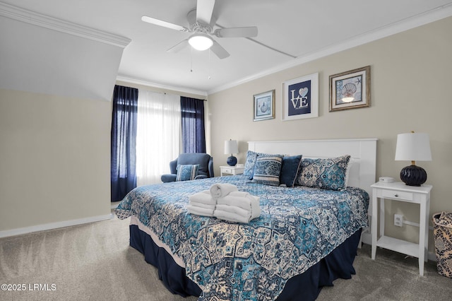 carpeted bedroom with ceiling fan and ornamental molding