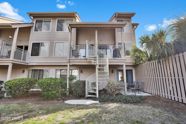 rear view of house featuring a patio