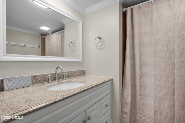 bathroom featuring ornamental molding and vanity