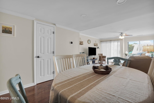 dining space featuring ceiling fan, crown molding, and dark hardwood / wood-style flooring