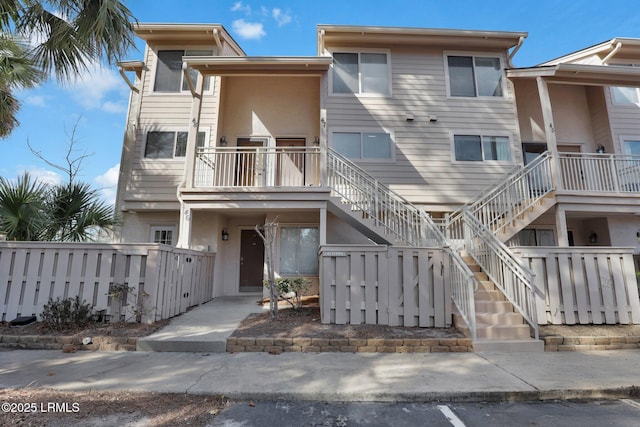 view of front of home with a balcony