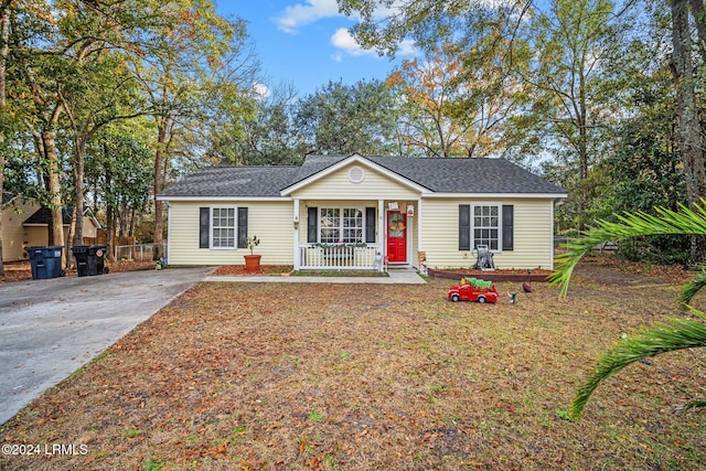 ranch-style home featuring covered porch