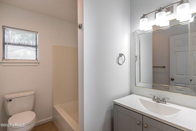 full bath featuring vanity and toilet