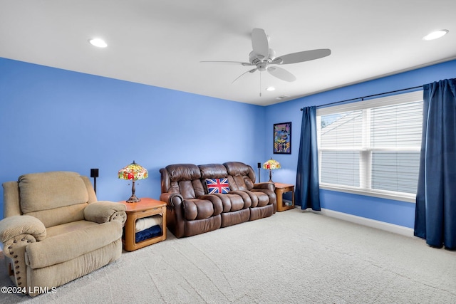 carpeted living room featuring ceiling fan