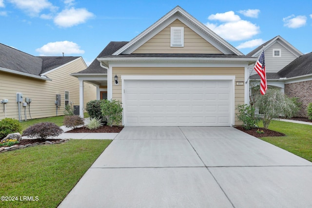 view of front facade with a garage and a front yard