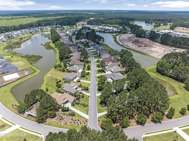 510 Dogwood Ln, Hardeeville, SC 29927 - aerial view of property and surrounding area featuring a large body of water, nearby suburban area, and a heavily wooded area