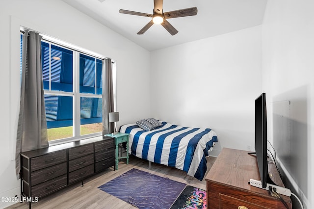 bedroom with wood finished floors and ceiling fan