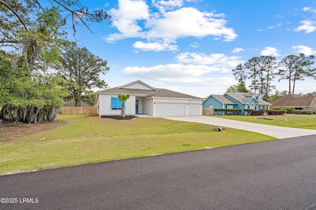 view of front of property featuring concrete driveway, a garage, a front lawn, and fence