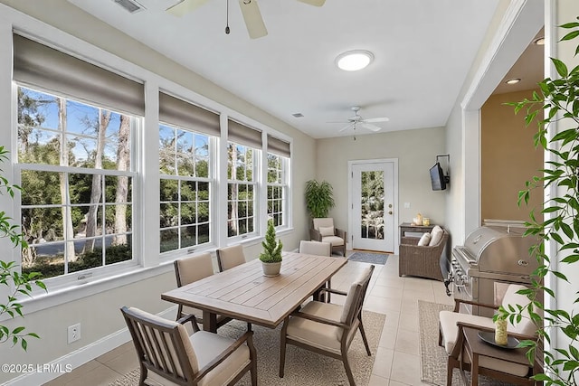 sunroom with a wealth of natural light and tile patterned floors