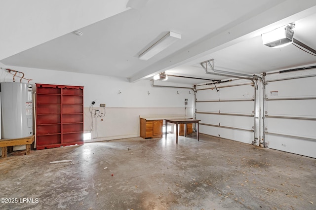 garage featuring water heater and a garage door opener