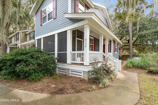 view of front of property with a sunroom