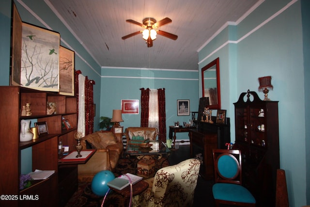 interior space with crown molding and ceiling fan