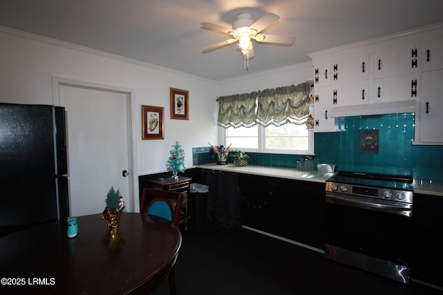 kitchen featuring crown molding, white cabinetry, black refrigerator, stainless steel electric range oven, and decorative backsplash