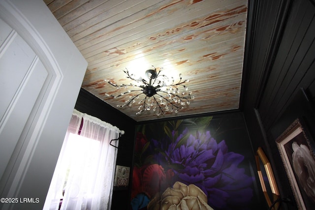 room details featuring an inviting chandelier and wood ceiling