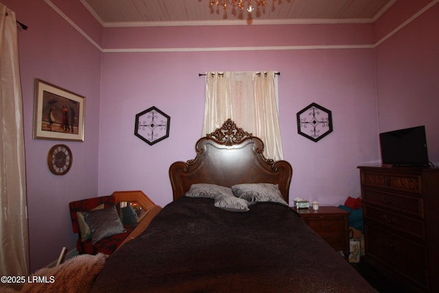 bedroom featuring crown molding