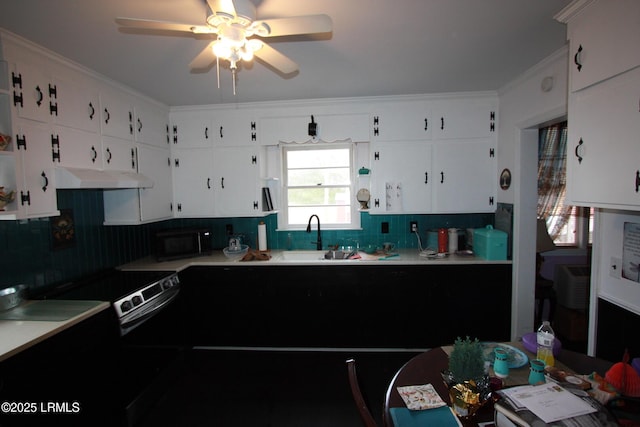 kitchen with sink, ceiling fan, white cabinetry, range with electric cooktop, and tasteful backsplash